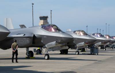 An airman waits for an F-35A Lightning II engine start-up during the Weapons System Evaluation Program-East 23.05 at Tyndall Air Force Base, Florida, Feb. 15, 2023.